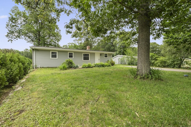 26 Oconnell Rd, East Haddam, CT 06423 - rear view of property featuring a chimney and a yard