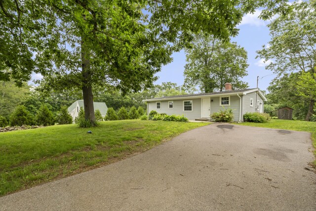 26 Oconnell Rd, East Haddam, CT 06423 - ranch-style house featuring asphalt driveway, a chimney, and a front yard