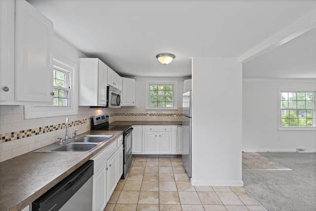 26 Oconnell Rd, East Haddam, CT 06423 - kitchen featuring appliances with stainless steel finishes, a sink, decorative backsplash, white cabinets, and light tile patterned floors