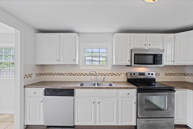 26 Oconnell Rd, East Haddam, CT 06423 - kitchen with appliances with stainless steel finishes, a sink, plenty of natural light, and white cabinets