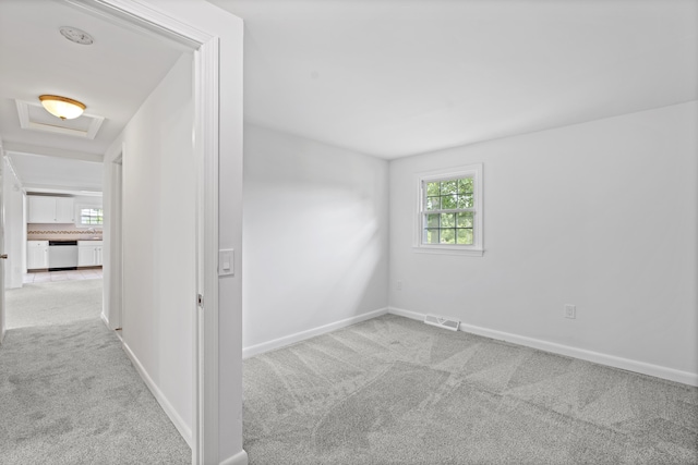 26 Oconnell Rd, East Haddam, CT 06423 - unfurnished room featuring light carpet, baseboards, and attic access