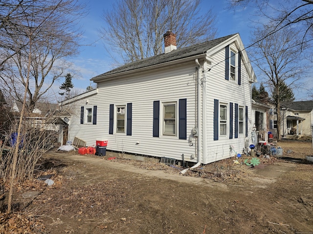 rear view of house with a chimney