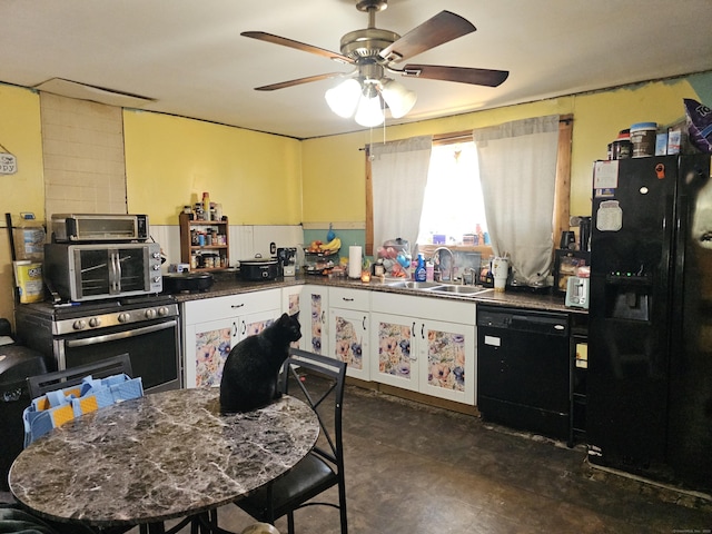 kitchen with a ceiling fan, black appliances, dark countertops, and a sink