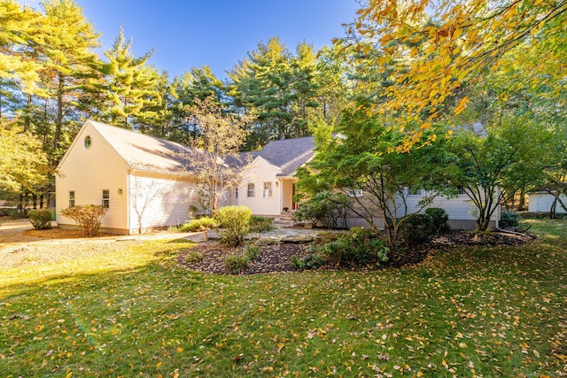 view of side of property featuring a yard