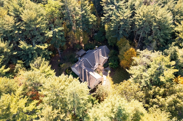 birds eye view of property with a view of trees