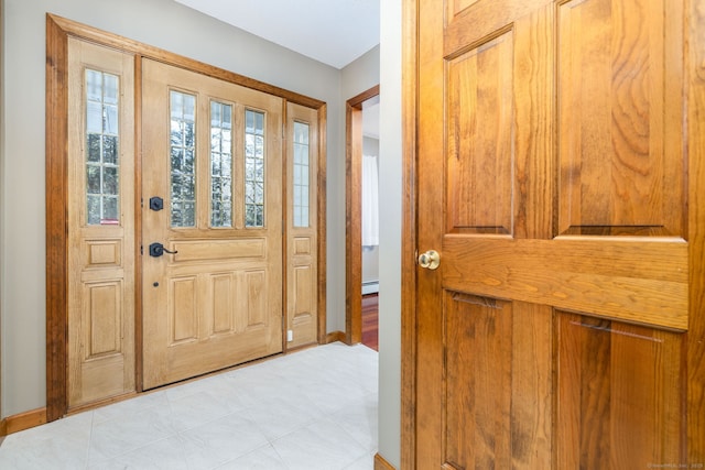 entryway with baseboards and a baseboard radiator