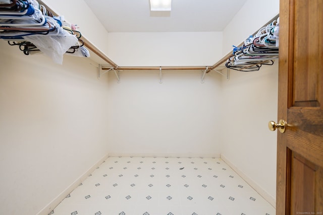 spacious closet featuring tile patterned floors