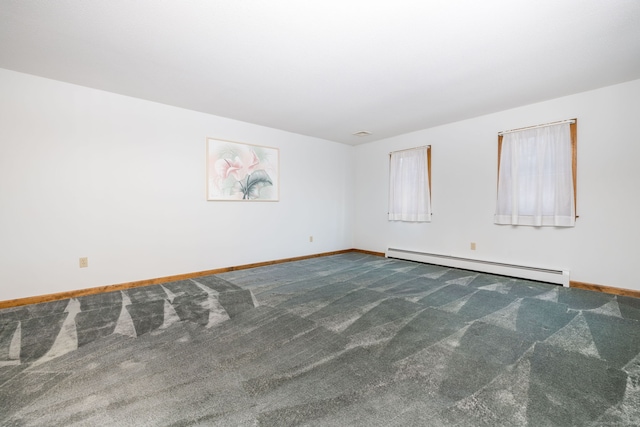 carpeted empty room featuring a baseboard heating unit and baseboards