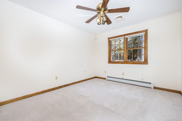 unfurnished room featuring baseboard heating, light colored carpet, baseboards, and visible vents