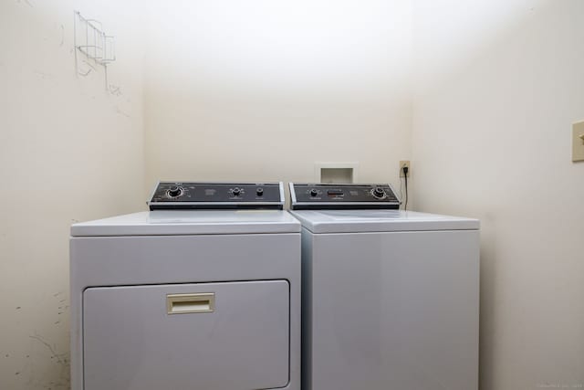 laundry room featuring independent washer and dryer and laundry area