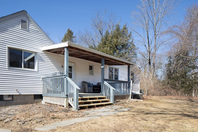 view of front facade with covered porch and crawl space