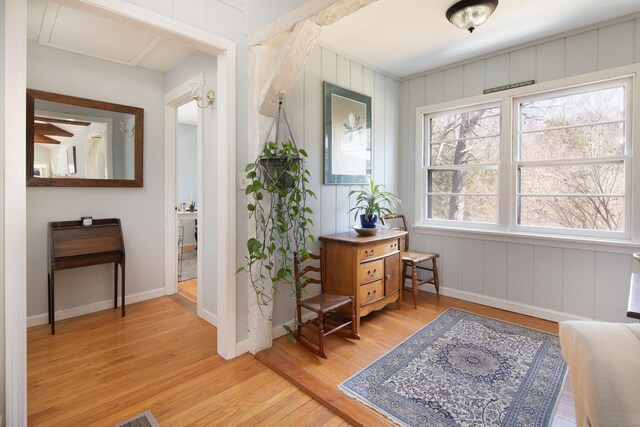 sitting room with light wood finished floors and baseboards