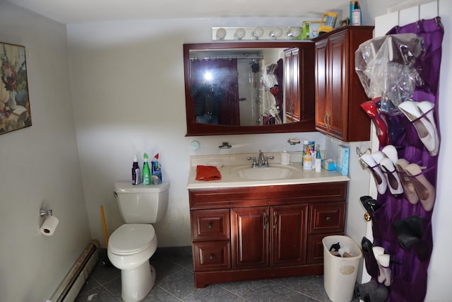 bathroom featuring tile patterned flooring, a baseboard heating unit, walk in shower, toilet, and vanity