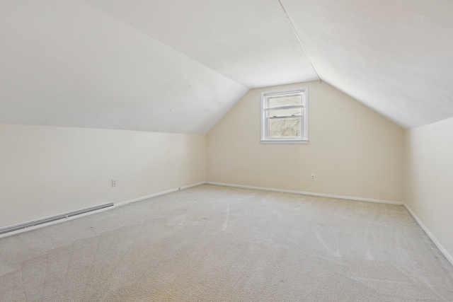 bonus room with baseboards, carpet floors, baseboard heating, and vaulted ceiling