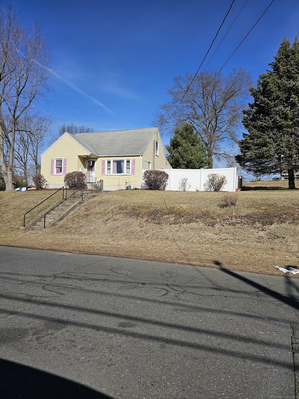 view of front of house featuring fence