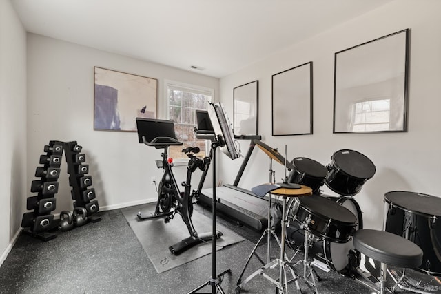 workout area with visible vents and baseboards