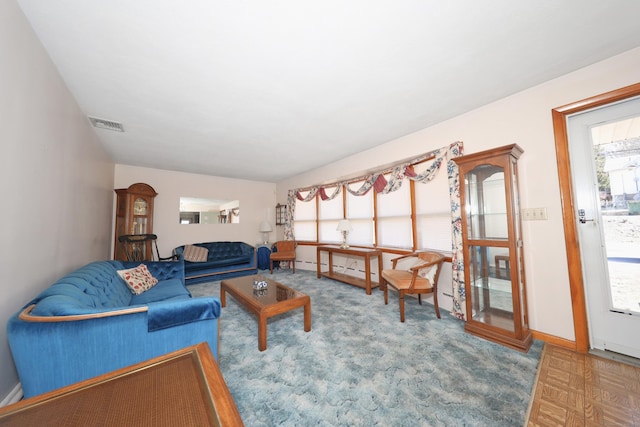 living room with visible vents and baseboards