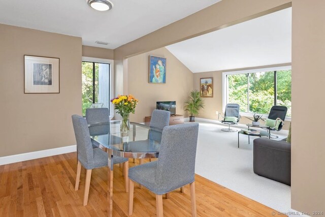 5 Cottonwood Ln Unit 5, Ridgefield, CT 06877 - dining area featuring lofted ceiling and wood finished floors