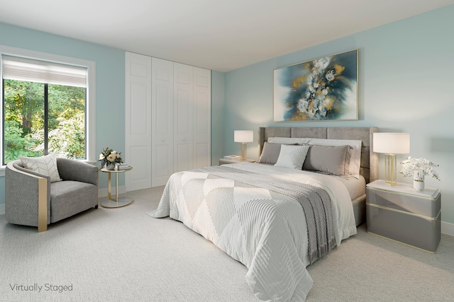 carpeted bedroom featuring baseboards and a closet