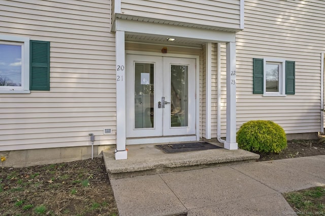view of exterior entry featuring french doors