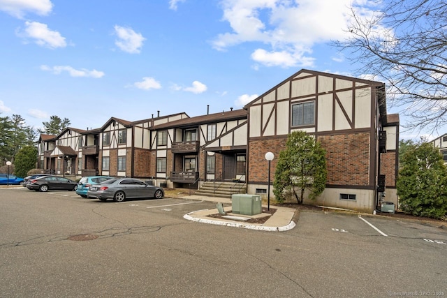 view of property with uncovered parking