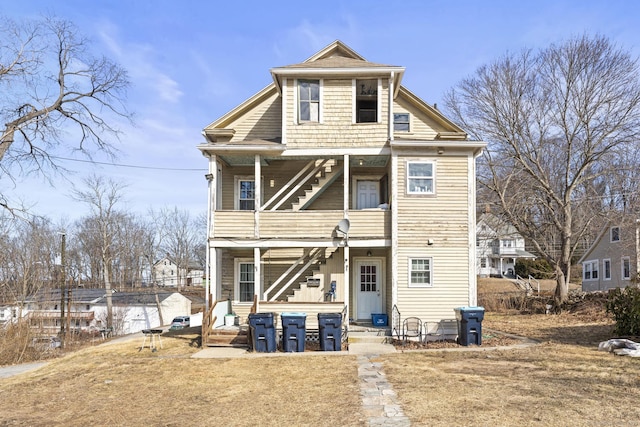 back of property featuring a balcony