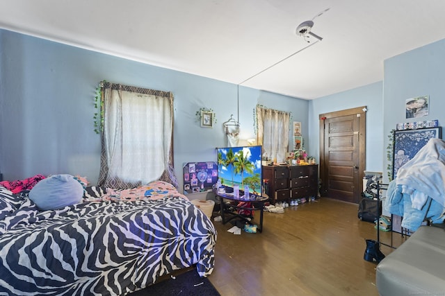 bedroom with wood finished floors