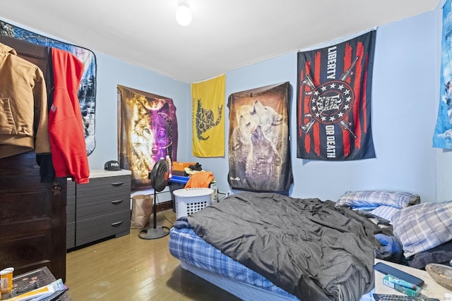 bedroom with wood finished floors