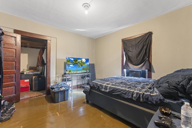 bedroom featuring wood finished floors