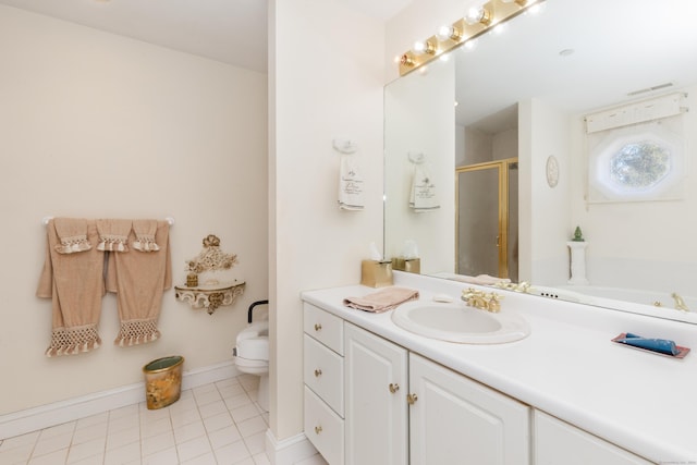 bathroom featuring baseboards, toilet, a shower stall, vanity, and tile patterned floors