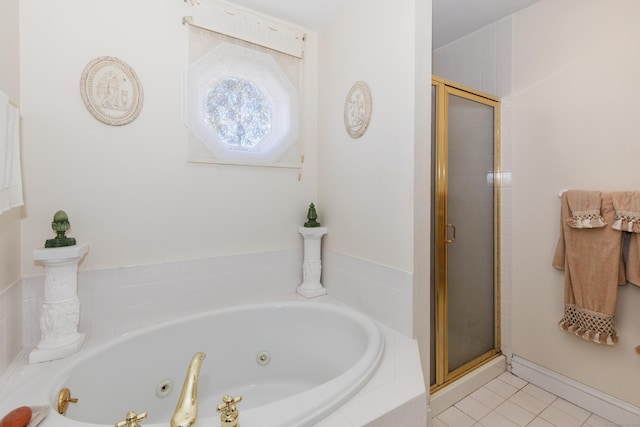 full bath featuring a jetted tub, tile patterned floors, and a stall shower