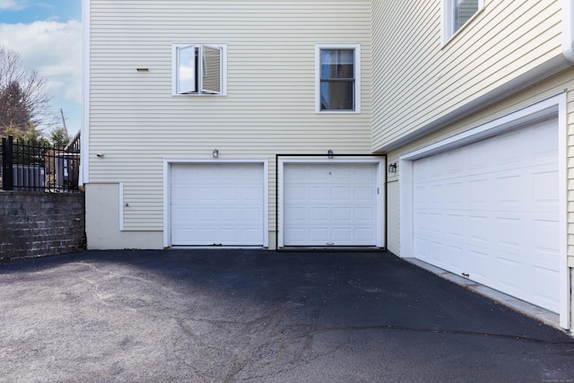 garage featuring driveway