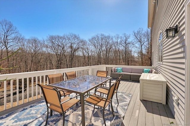 deck featuring an outdoor hangout area and outdoor dining space