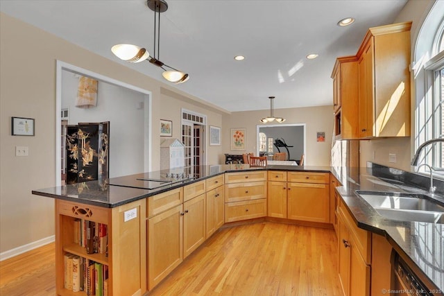 kitchen with a sink, dishwashing machine, light wood-style flooring, black electric cooktop, and open shelves