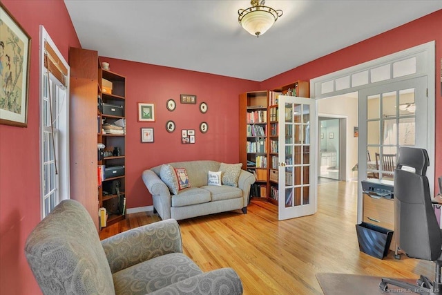 interior space with wood finished floors and french doors