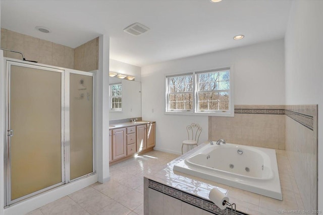 bathroom featuring tile patterned floors, visible vents, a stall shower, a jetted tub, and vanity