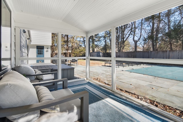 sunroom / solarium featuring wood ceiling and vaulted ceiling