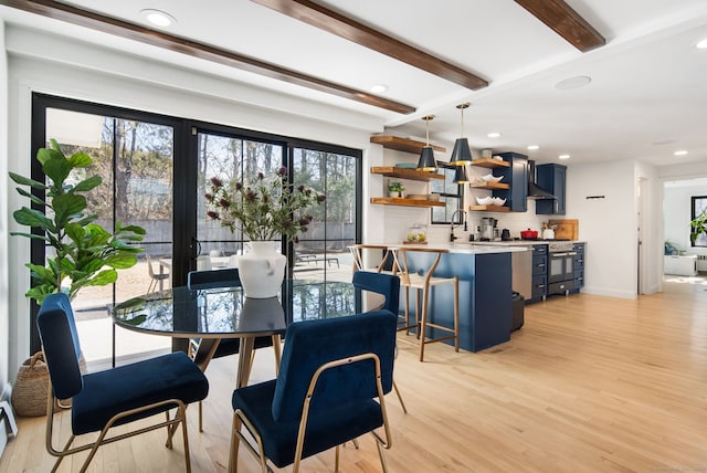 dining space with beamed ceiling, recessed lighting, and light wood-type flooring