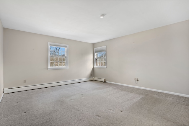 carpeted empty room featuring baseboards and a baseboard radiator