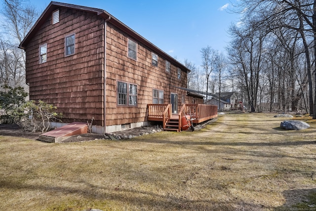 view of home's exterior with a yard and a deck