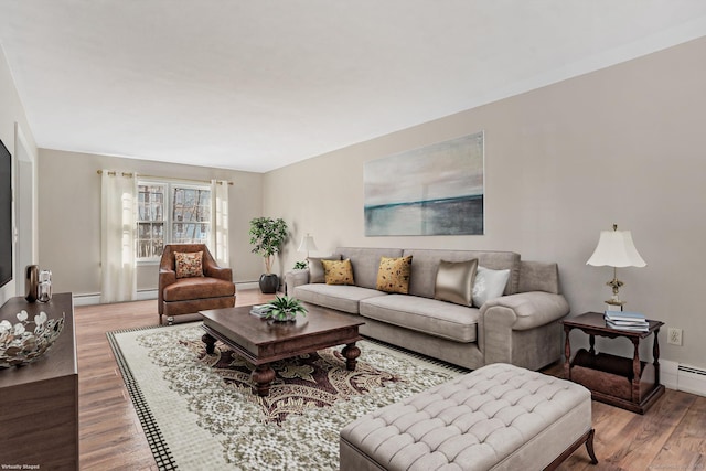 living room featuring baseboards and wood finished floors