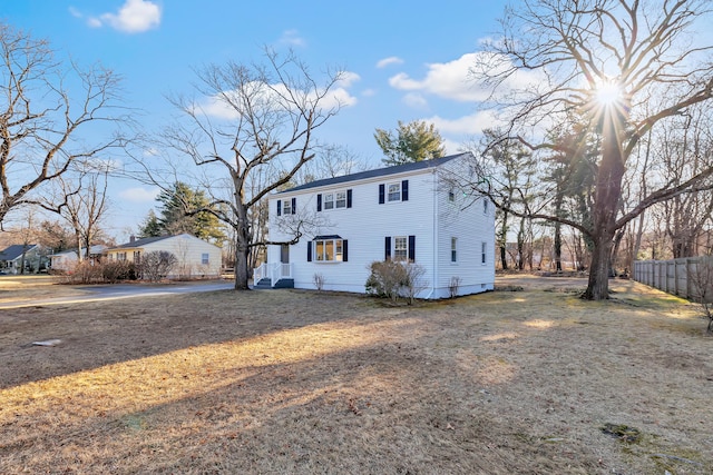 view of front of house featuring fence