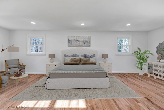 bedroom featuring recessed lighting, baseboards, and wood finished floors