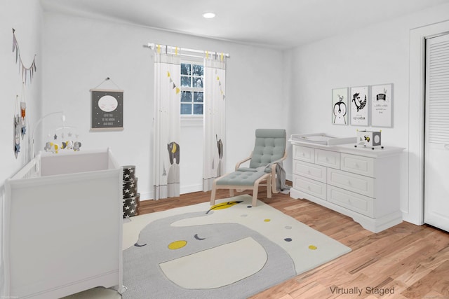 bedroom with recessed lighting, baseboards, and light wood-style floors