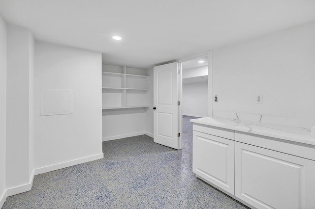 interior space with recessed lighting and baseboards