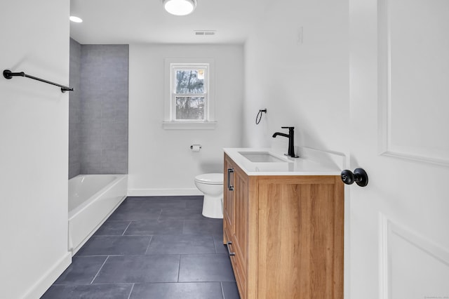 bathroom featuring vanity, baseboards, visible vents, tile patterned flooring, and toilet