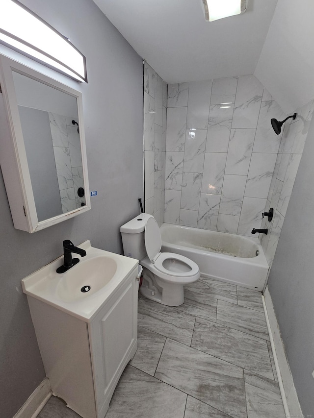 bathroom with vanity, baseboards, toilet, marble finish floor, and shower / bathtub combination