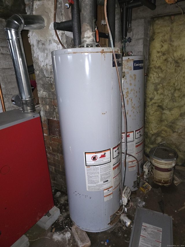 utility room featuring gas water heater