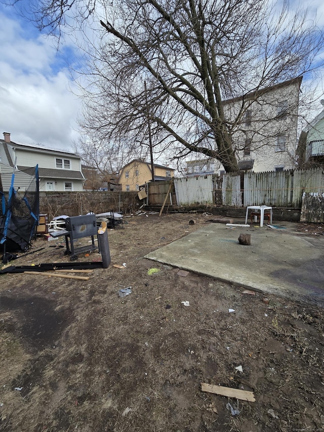 view of yard with a patio area and a fenced backyard