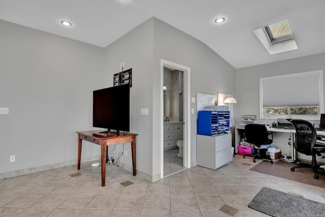 tiled office with lofted ceiling with skylight, recessed lighting, and baseboards